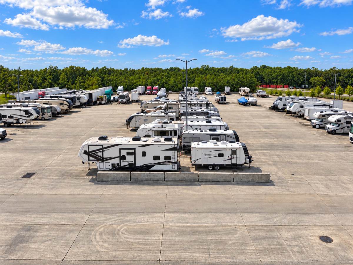 Aerial view of RVs, travel trailers and boats parked on the all-concrete Philips RV and Boat Storage lot in South Jacksonville, FL
